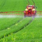 FArmer spreading nitrogen fertilizer