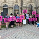 Protesters in front of Victoria Hall
