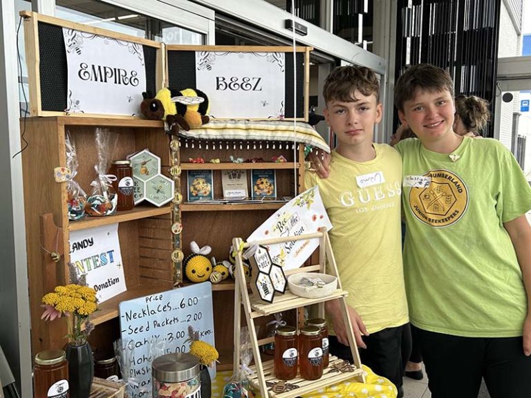Owen Musson (left) and Sabastian Smith of Empire Beez, showcase their honey business at a youth business expo in Cobourg. Photo by Dan Jones, CFWN, LJI