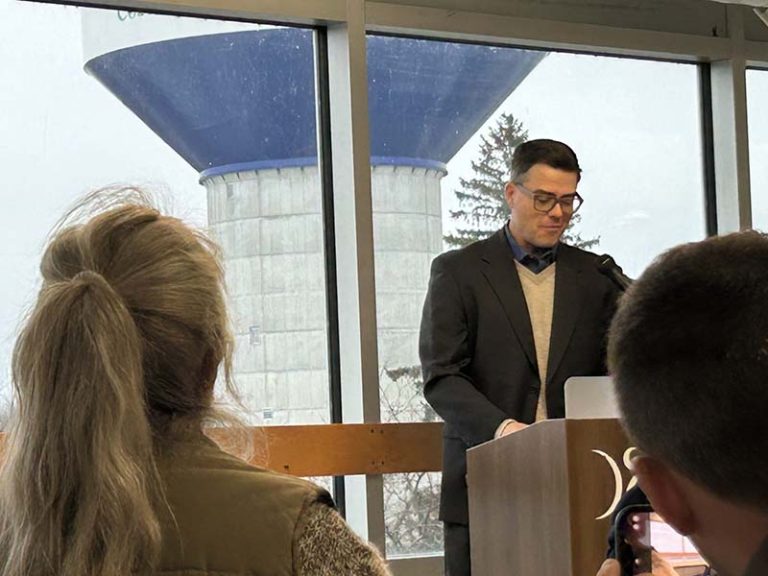 Cobourg Mayor Lucas Cleveland unveils the new water tower, which is located in the background. By Dan Jones, CFWN, LJI