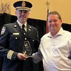 Port Hope Fire Chief Jason Williams and Don Casey, the Vice President of the OMFPOA during recent award ceremony for Fire Chief of the Year 2026