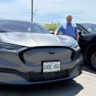 David Kunhke standing next to his Electric Ford Mustang. Photo by Dan Jones, CFWN, LJI
